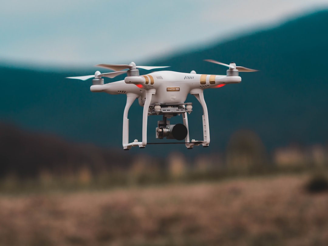 selective-focus-photography-of-dji-phantom-3-professional-quadcopter-drone-dunhkmskw6m